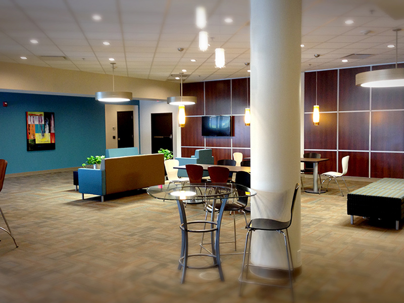 Office lobby with blue and wooden accent walls, showcasing commercial painting in Canton by Frank Kaye Painting.