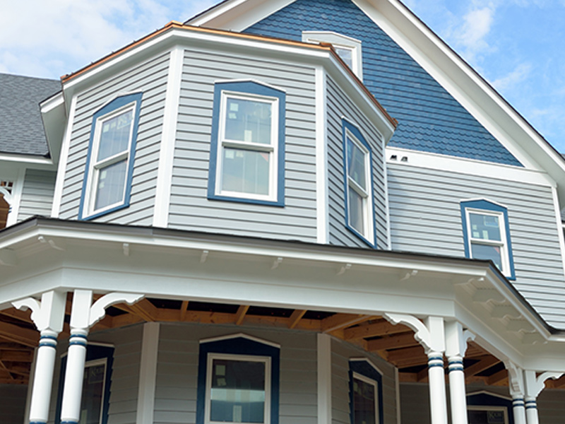 canton ohio exterior painting Light blue house with royal blue accents, white trim and a wrap around porch.
